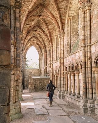 “My heart is my own.” ↟
↟
↟
📍 Holyrood Abbey, Edinburgh, Scotland, 2016 ↟
↟
↟
The story behind Holyrood Abbey goes something like, King David, went out hunting during the Feast of the Cross. And after being bucked off his trusty steed, came face to face with a disgruntled stag. ↟
↟
↟
The King noticed a crucifix between the stag’s antlers or a Holy Cross projected just as the stag backed away. Needless to say, the stag didn’t maul the King. Grateful, the King saw this as a purely spiritual event and founded Holyrood Abbey in that very area.
↟
↟
↟
I’ve always been really fascinated by Mary Queen of Scots. Some see her as a murderer and a traitor while others believe she was a courageous martyr. I tend to lean towards the later. If you are also a fan of Mary Queen of Scots you can’t beat The Palace at Holyrood or Holyrood Abbey. ↟
↟
↟
After all, the abbey is where Queen Mary famously married the absolute waste of space Lord Darnley at 22. There is something to be said for the way she followed her heart. And it doesn’t hurt that the ruins of the abbey are stunningly beautiful! ↟
↟
↟